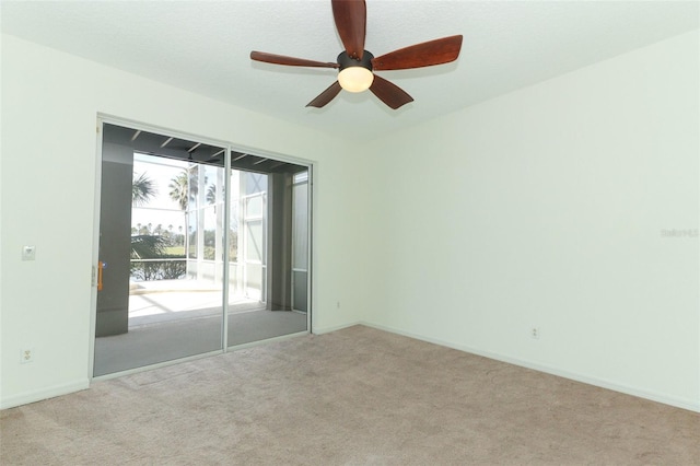 carpeted empty room with ceiling fan