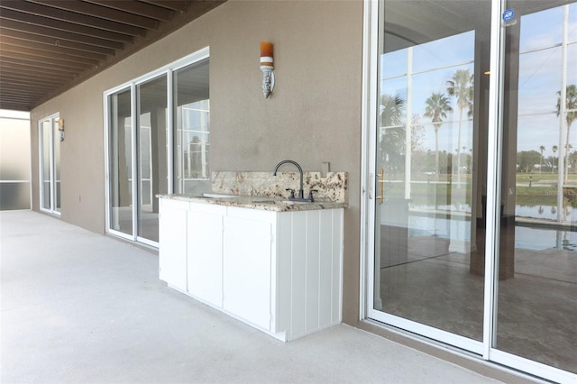 exterior space with an outdoor wet bar