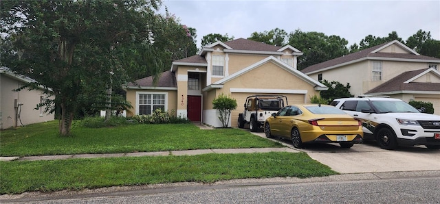 front facade with a front lawn and a garage