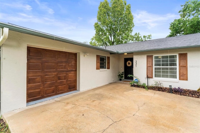 ranch-style home with a garage