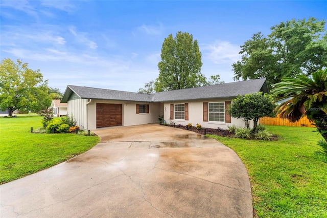 ranch-style house with a garage and a front yard