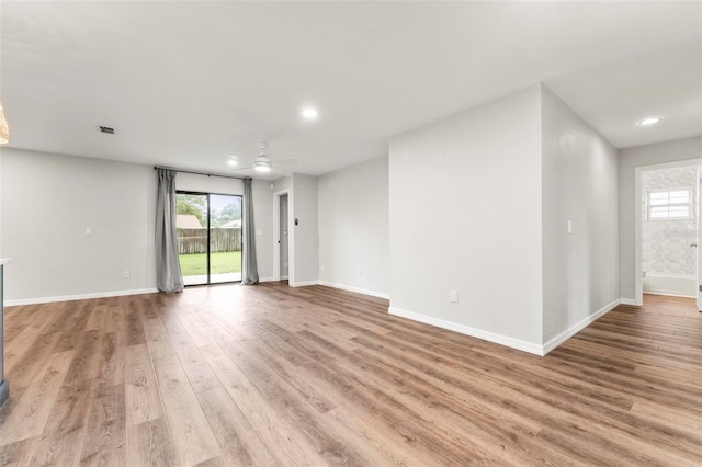 empty room featuring light wood-type flooring and ceiling fan