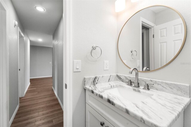 bathroom featuring wood-type flooring and vanity