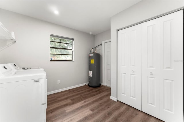 laundry area featuring dark wood-type flooring, water heater, and washer and dryer