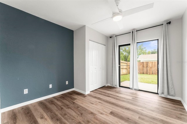 empty room featuring ceiling fan and hardwood / wood-style flooring