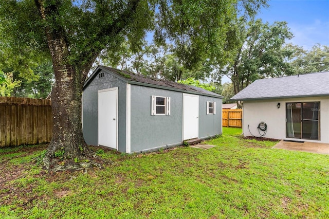 view of outdoor structure featuring a yard