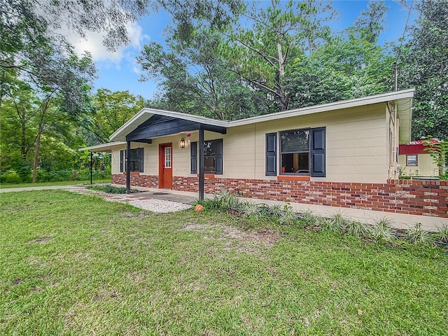 ranch-style house with a front yard