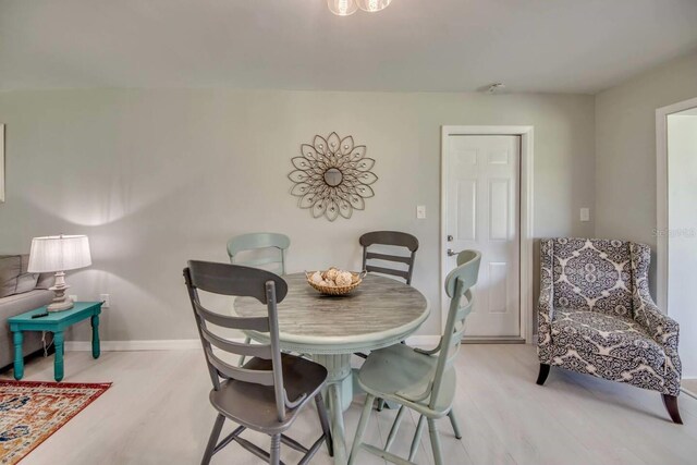 dining area with light wood-type flooring