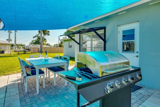 view of patio featuring a grill