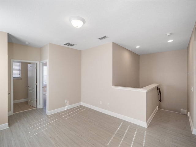 empty room with light wood-type flooring