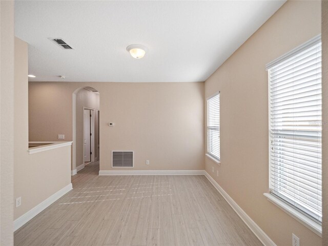 unfurnished room with light hardwood / wood-style floors