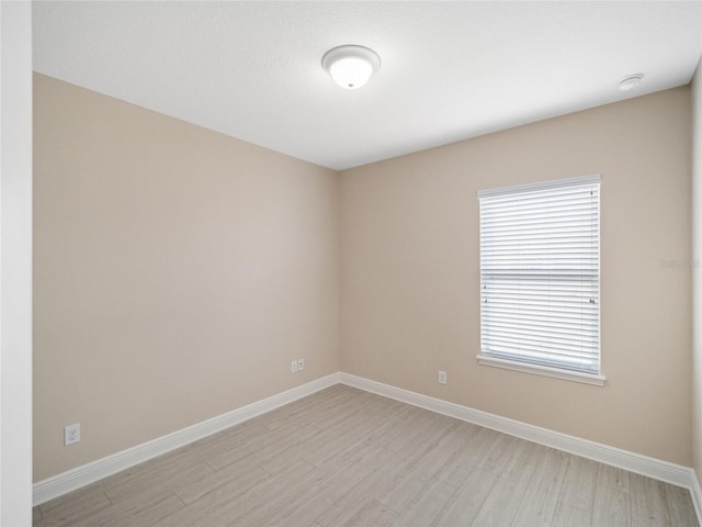 unfurnished room featuring light hardwood / wood-style flooring