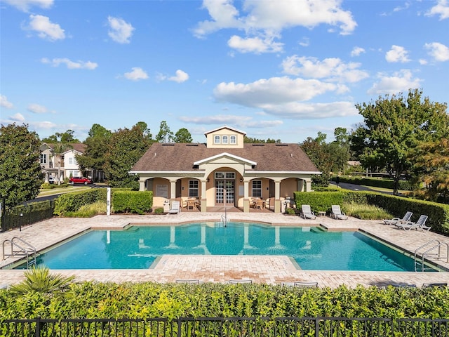 view of swimming pool with a patio area