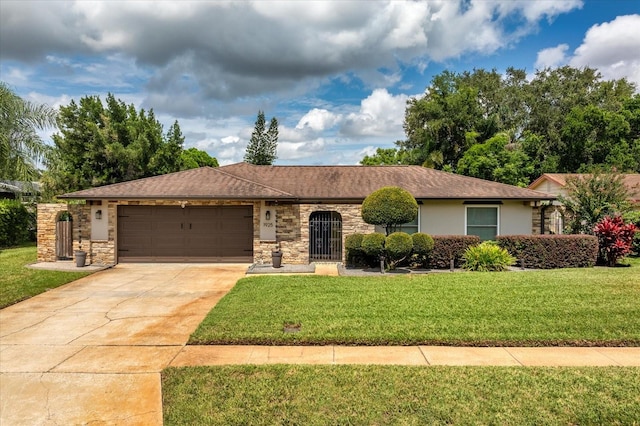 ranch-style house featuring a garage and a front lawn