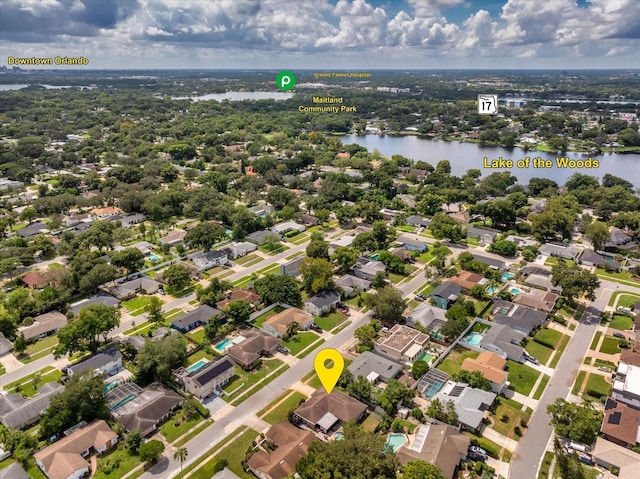 birds eye view of property with a water view