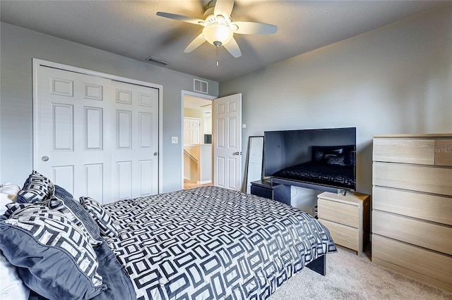 bedroom featuring a closet, ceiling fan, and carpet floors