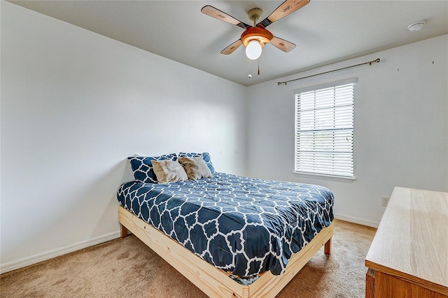 bedroom with ceiling fan and carpet