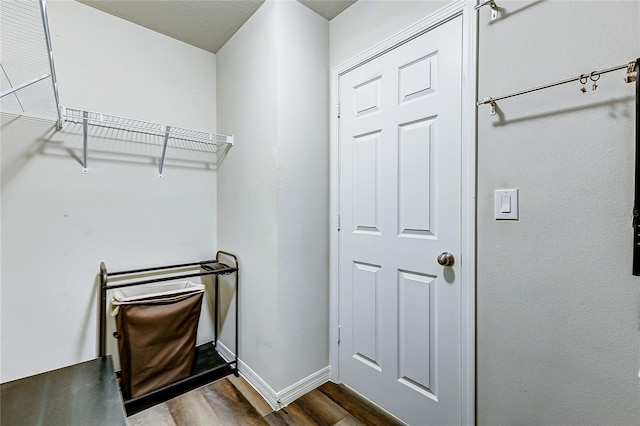 walk in closet featuring dark hardwood / wood-style floors