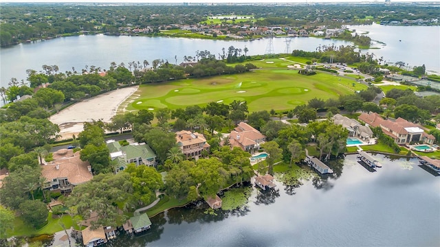 birds eye view of property featuring view of golf course and a water view