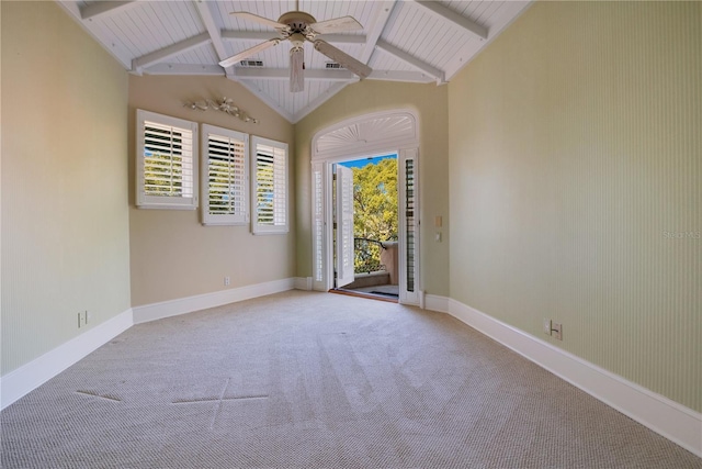 carpeted empty room featuring lofted ceiling with beams, baseboards, and a ceiling fan