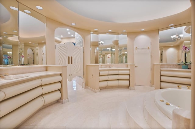 full bathroom with a sink, a bath, two vanities, and recessed lighting