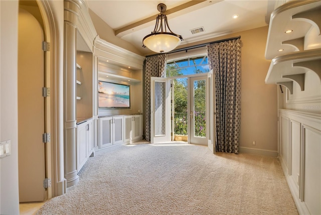 unfurnished dining area with recessed lighting, light carpet, visible vents, baseboards, and beamed ceiling