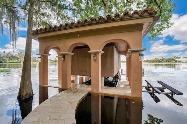 view of dock featuring a water view and boat lift