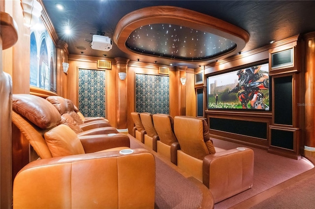 carpeted cinema featuring ornamental molding