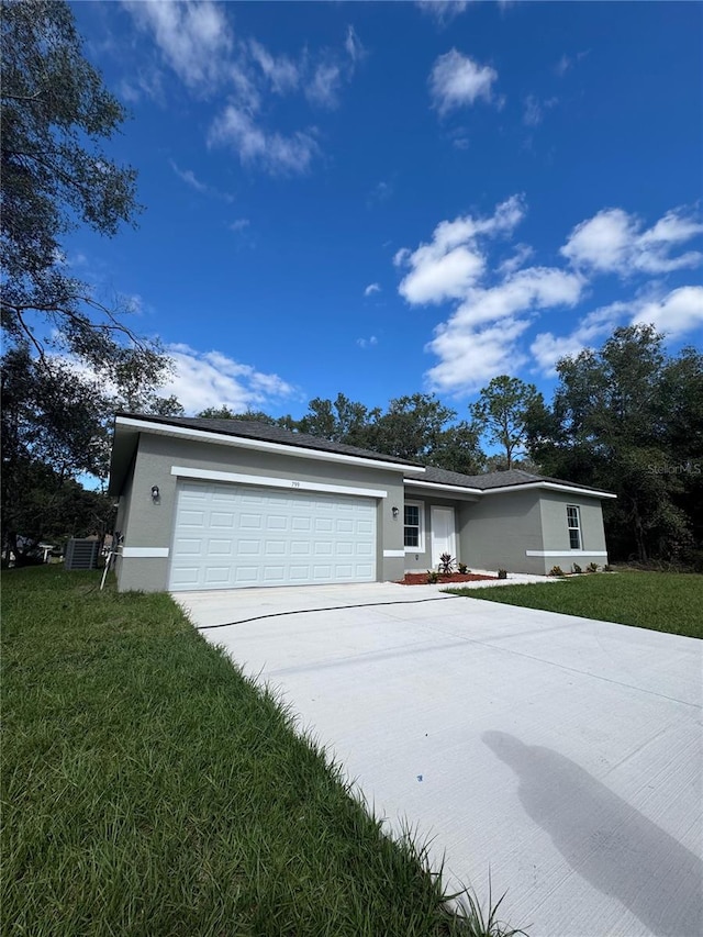 ranch-style home with central AC, a front yard, and a garage