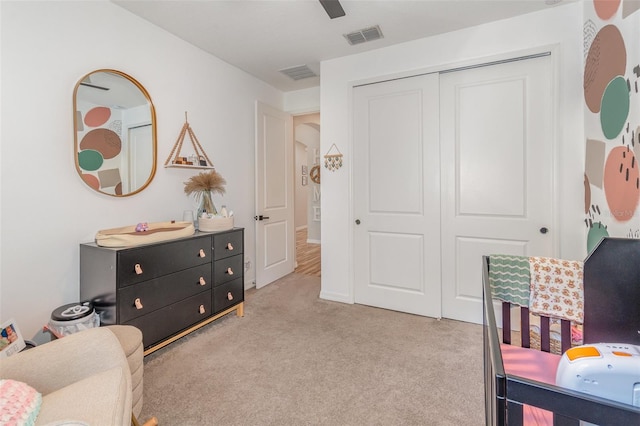 interior space with ceiling fan and a closet