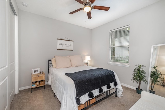 bedroom featuring carpet, ceiling fan, and a closet