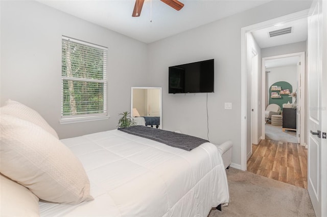 carpeted bedroom featuring ceiling fan