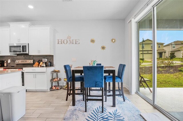 dining room with light wood-type flooring