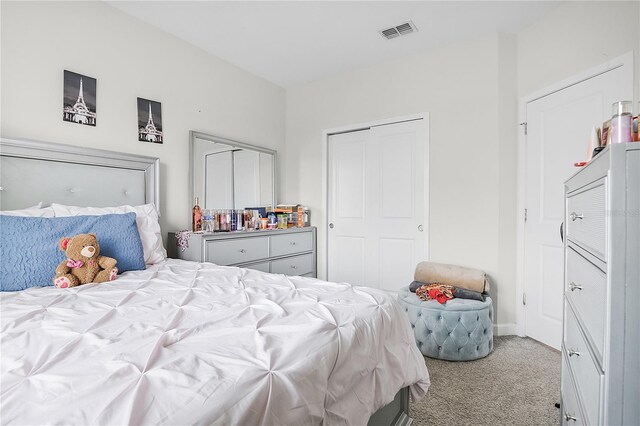 bedroom featuring light colored carpet