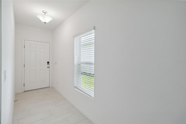 interior space featuring light tile patterned floors and plenty of natural light