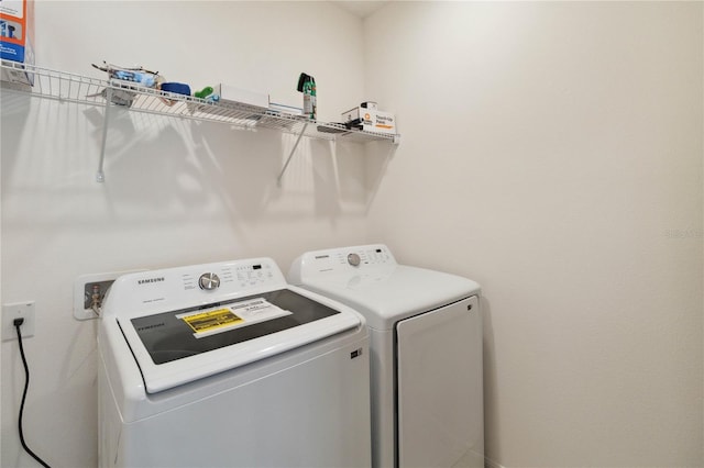 washroom with washing machine and dryer