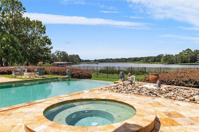 view of pool with a fenced in pool, a patio, an in ground hot tub, a water view, and fence