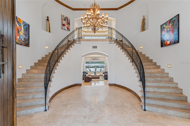 foyer with ornamental molding, stairway, an inviting chandelier, and baseboards