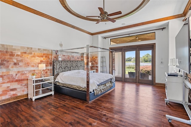 bedroom with access to exterior, dark wood-style floors, a raised ceiling, ornamental molding, and baseboards