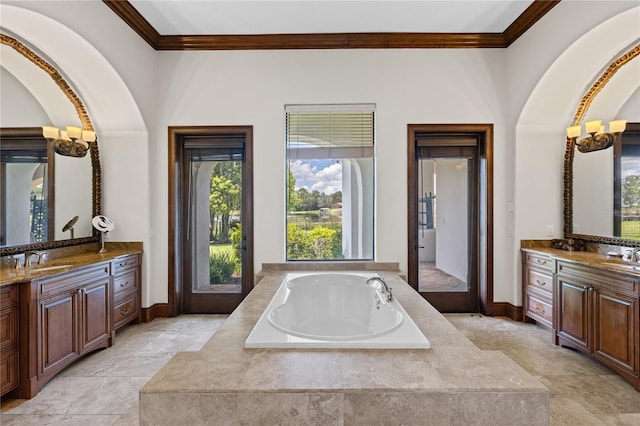 bathroom with two vanities, a sink, and crown molding