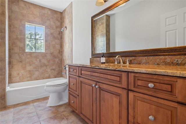 bathroom with toilet, tile patterned floors, vanity, and shower / bathing tub combination