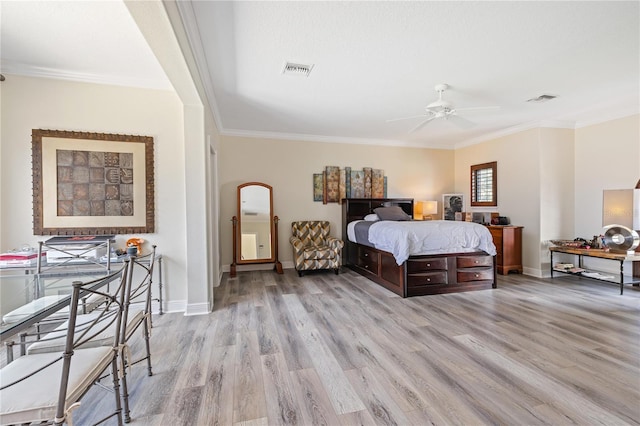 bedroom with visible vents, light wood-style flooring, and baseboards