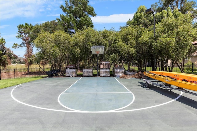 view of basketball court with community basketball court and fence