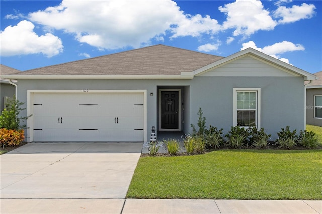 ranch-style house with a front yard and a garage