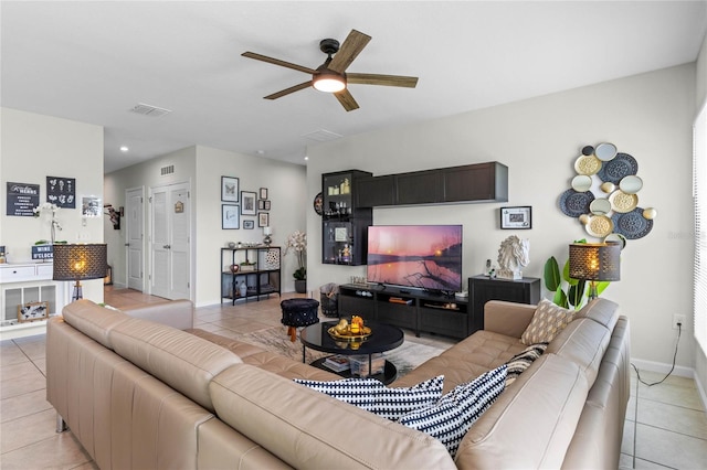 living room with light tile patterned floors and ceiling fan