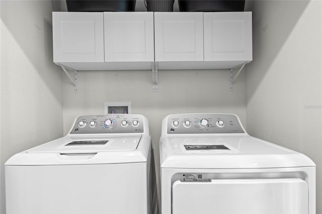 laundry area featuring cabinets and washer and dryer