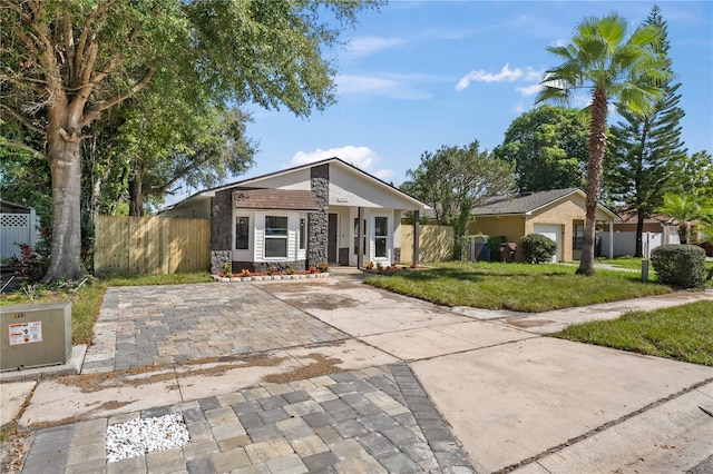 ranch-style house with a front lawn