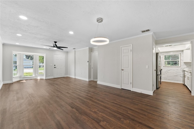 unfurnished living room with ceiling fan, a textured ceiling, and dark hardwood / wood-style floors