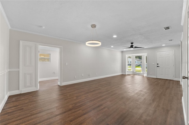 unfurnished living room featuring ornamental molding, ceiling fan, and dark wood-type flooring