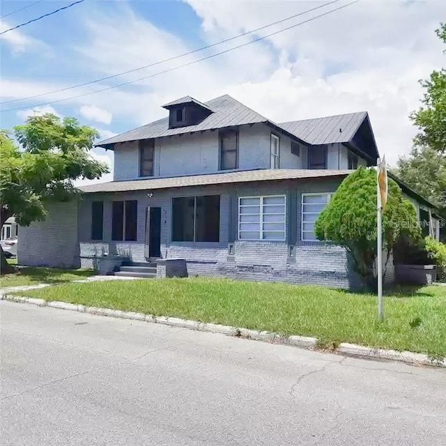 view of front of home with a front yard